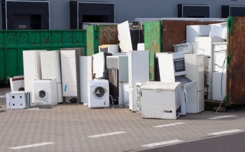 electrical-goods Collected and awaiting for the disposal of electronic-waste - refrigerators, washing machines and others.